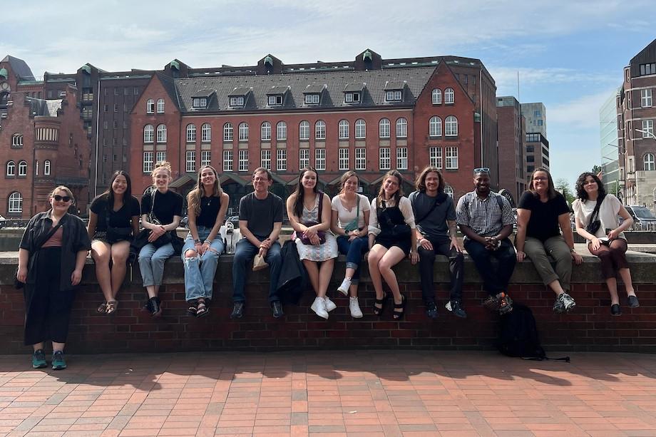 Students posed on a wall in germany